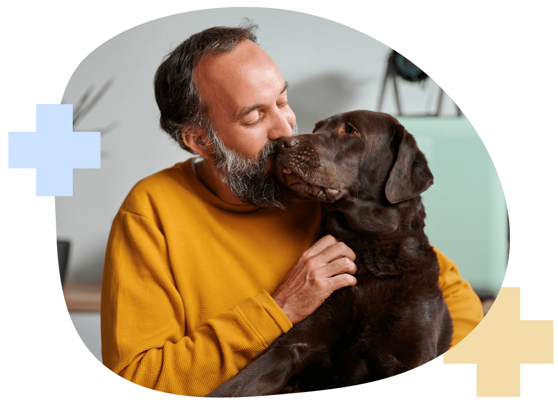 Man Holding Dog | Compare Health Insurance Plans
