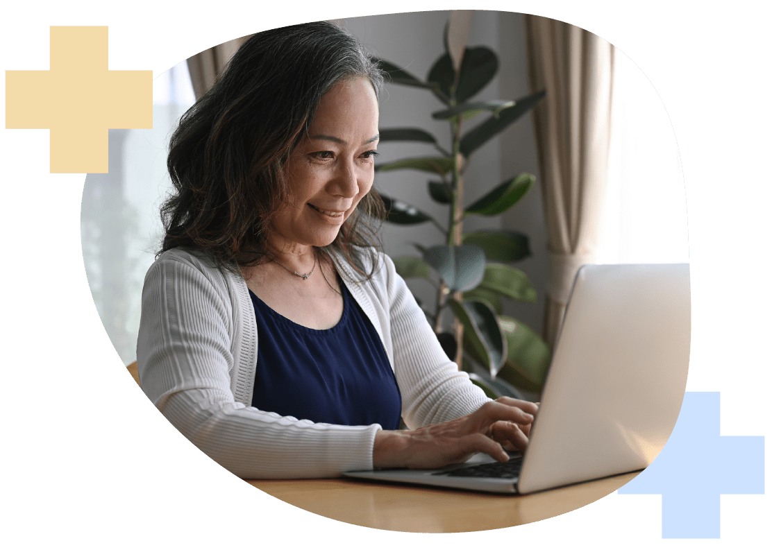 Woman at Computer Comparing Health Insurance Plans